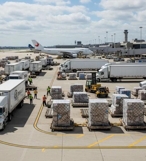 JFK airport cargo area with trucks and freight operations